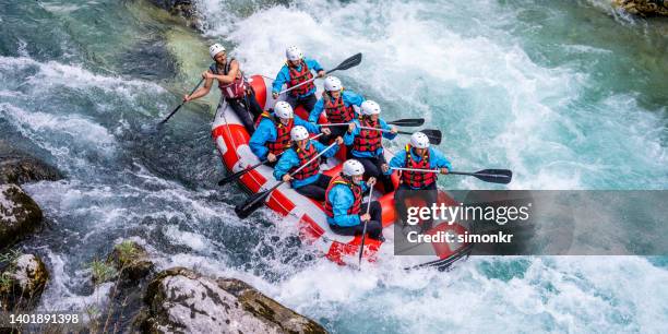 friends rafting in river - rafting stock pictures, royalty-free photos & images