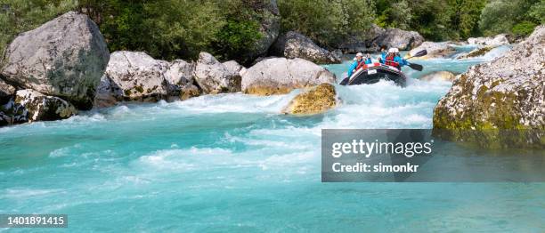 friends rafting in river - slovenia soca stock pictures, royalty-free photos & images