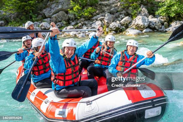 friends rafting in river - white water rafting stock pictures, royalty-free photos & images