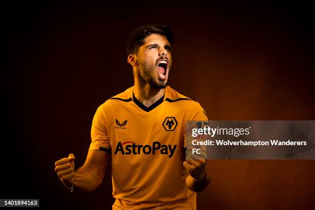 Pedro Neto of Wolverhampton Wanderers poses for a portrait wearing the new 2022/23 Wolverhampton Wanderers Home Kit at The Sir Jack Hayward Training...