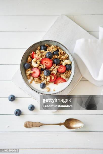 granola with yogurt and strawberries - oats food stock pictures, royalty-free photos & images