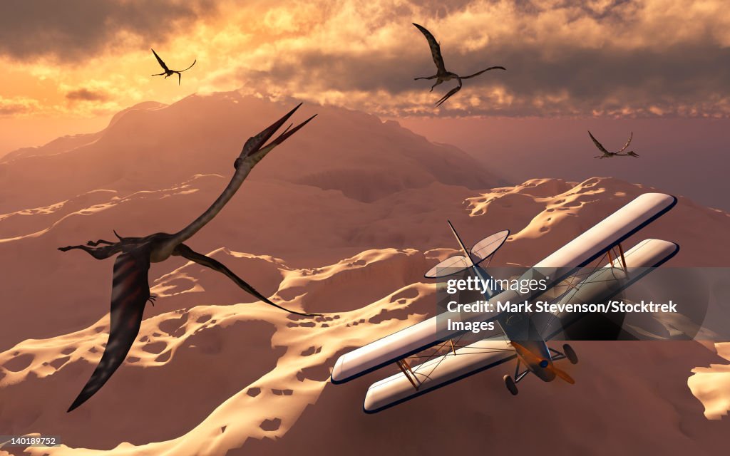 A 1930's Tiger Moth biplane passes through a flock of prehistoric Quetzalcoatlus pterosaurs.