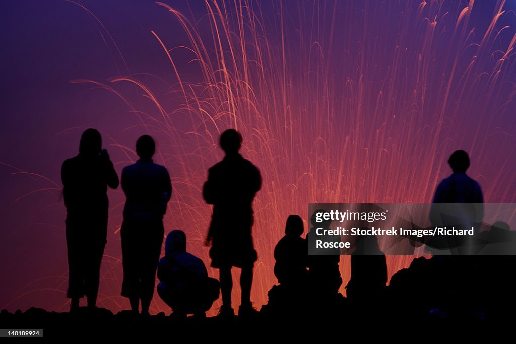 March 6, 2010 - Silhouette of tourists observing the Strombolian eruption of Yasur Volcano, Tanna Island, Vanuatu.