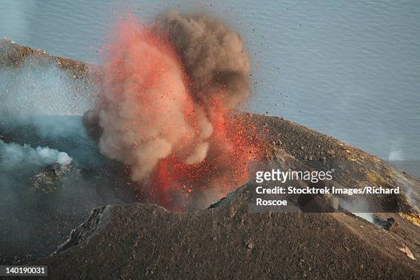 strombolian eruption of stromboli volcano producing ash cloud, volcanic bombs and lava, italy. - aeolian islands stock pictures, royalty-free photos & images