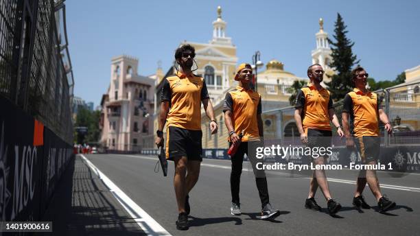 Lando Norris of Great Britain and McLaren walks the track with his team during previews ahead of the F1 Grand Prix of Azerbaijan at Baku City Circuit...