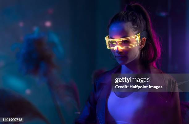 futuristic young woman in vr environment with smart glasses. - virtual reality glasses stockfoto's en -beelden