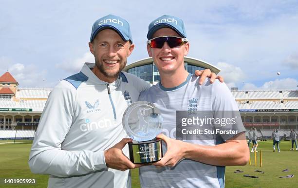 England batsman Joe Root presents Harry Brook with his PCA Player of the month for May during nets ahead of the Second Test Match between England and...