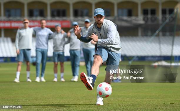 England bowler Jack Leach scores a penalty during a football penalty shoot out as his team mates from the South team look on during nets ahead of the...