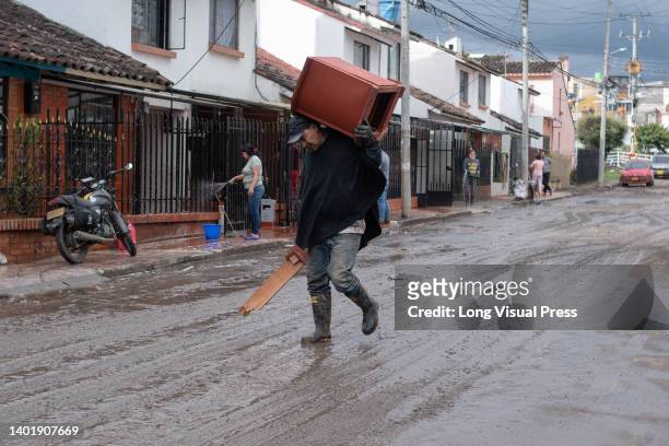 Heavy rains cause the overflow of a river in Pasto - Narino, Colombia, which affects dozens of families, who suffer millions in losses on June 8,...
