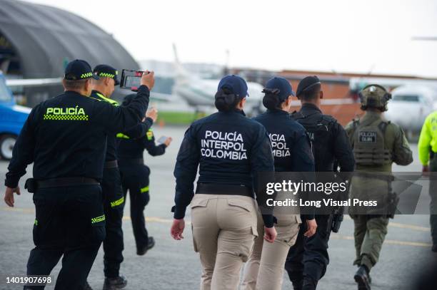 Colombian police, prosecutors officers and special operations commandos prepare the arrival at the 'CATAM' Airbase of the persons implicated in the...