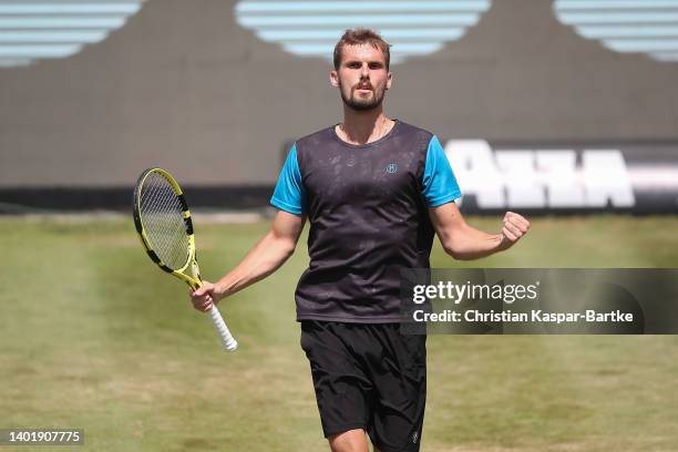 Oscar Otte of Germany celebrates after winning the round of 16 match against Denis Shapovalov of Canada during day four of the BOSS OPEN at...