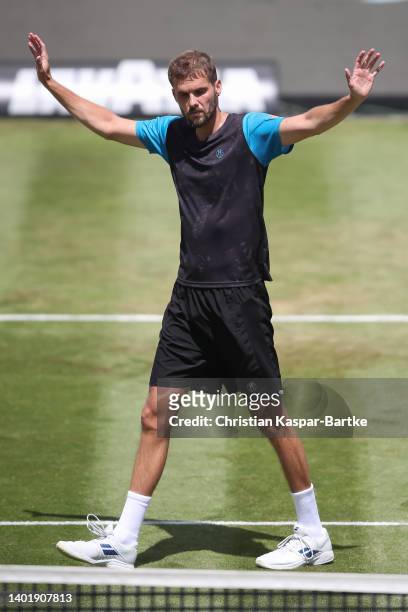 Oscar Otte of Germany celebrates after winning the round of 16 match against Denis Shapovalov of Canada during day four of the BOSS OPEN at...
