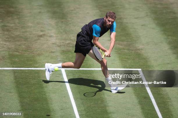 Oscar Otte of Germany plays a backhand during the round of 16 match between Oscar Otte of Germany and Denis Shapovalov of Canada during day four of...