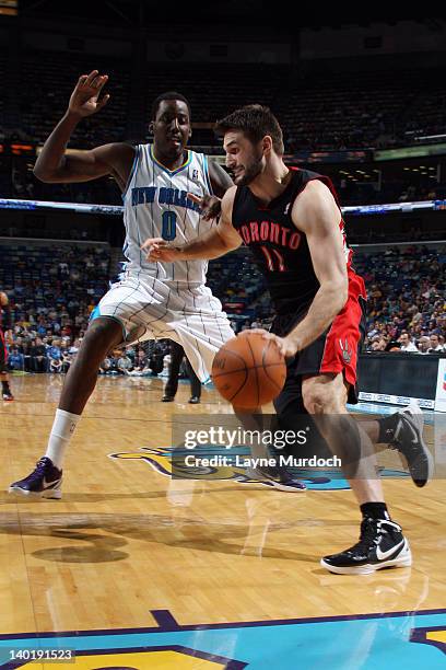 Linas Kleiza of the Toronto Raptors goes to the basket against Al-Farouq Aminu of the New Orleans Hornets during the game on February 29, 2012 at the...