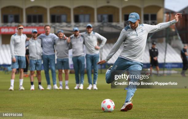 Joe Root of England kicks the ball during a penalty shootout during a training session before the second Test against New Zealand at Trent Bridge on...