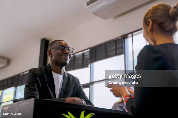 passengers are talking with waitress in the station. waiting for jouney. - tourist asking stock pictures, royalty-free photos & images