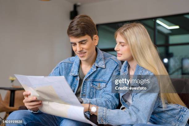 passengers are sitting in the station. waiting for jouney. - man in denim jacket stock pictures, royalty-free photos & images