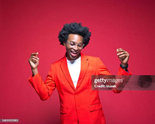 businessman enjoying dance - red blazer stock pictures, royalty-free photos & images