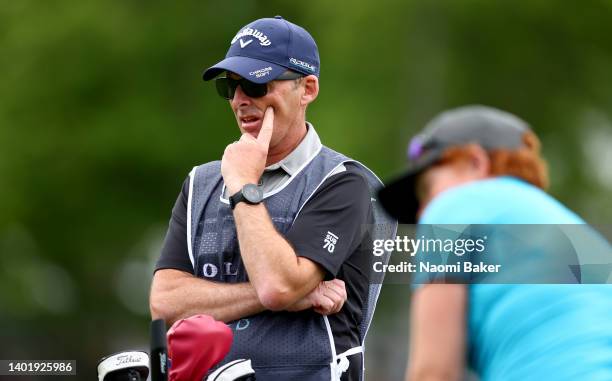 Ex Premier League referee, Mike Dean who is caddying for Felicity Johnson of England during the first round of the Volvo Car Scandinavian Mixed...