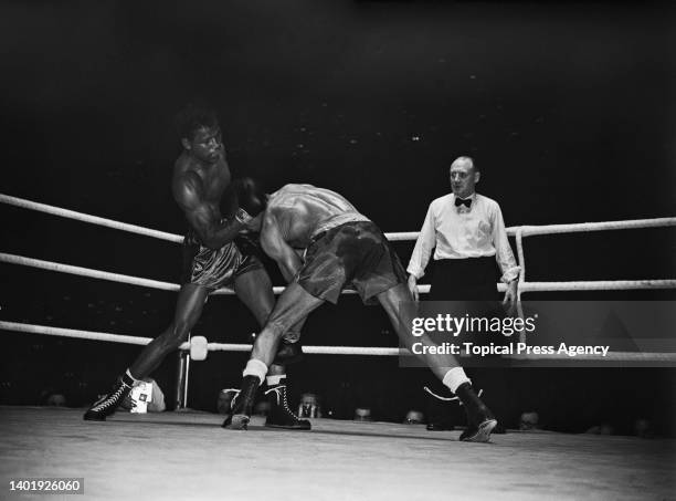 British boxer Randolph Turpin and American boxer Sugar Ray Robinson in action at Earl's Court, London, UK, 10th July 1951.