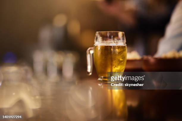 cold beer in a pub! - ale stock pictures, royalty-free photos & images