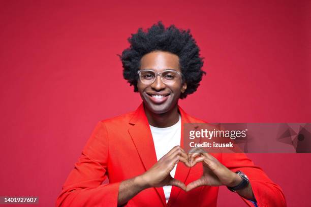 happy man gesturing heart shape - valentines african american 個照片及圖片檔