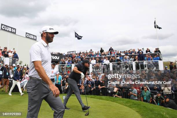 Dustin Johnson of 4 Aces GC and Phil Mickelson of Hy Flyers GC walk from the 1st tee during day one of the LIV Golf Invitational - London at The...