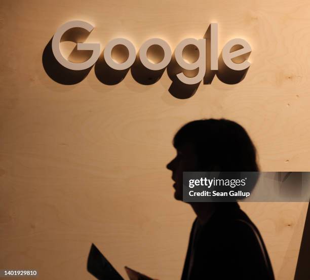 Participant walks past a Google logo at a stand at the 2022 Re:publica digital society festival on June 09, 2022 in Berlin, Germany. The three-day...