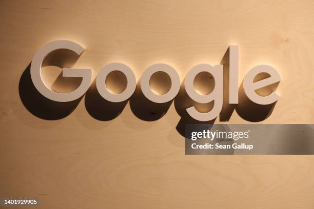 Wooden Google logo hangs at a stand at the 2022 Re:publica digital society festival on June 09, 2022 in Berlin, Germany. The three-day event brings...