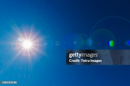 Blue sky with solar flare Blue sky with solar flare