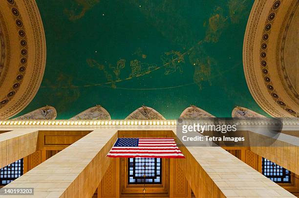 usa, new york city, grand central station interior with us flag - grand central station manhattan stock pictures, royalty-free photos & images