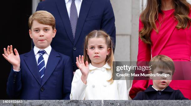 Prince George of Cambridge, Princess Charlotte of Cambridge and Prince Louis of Cambridge stand on the balcony of Buckingham Palace following the...