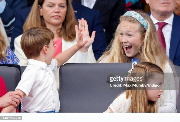 Prince Louis of Cambridge and Savannah Phillips attend the Platinum Pageant on The Mall on June 5, 2022 in London, England. The Platinum Jubilee of...