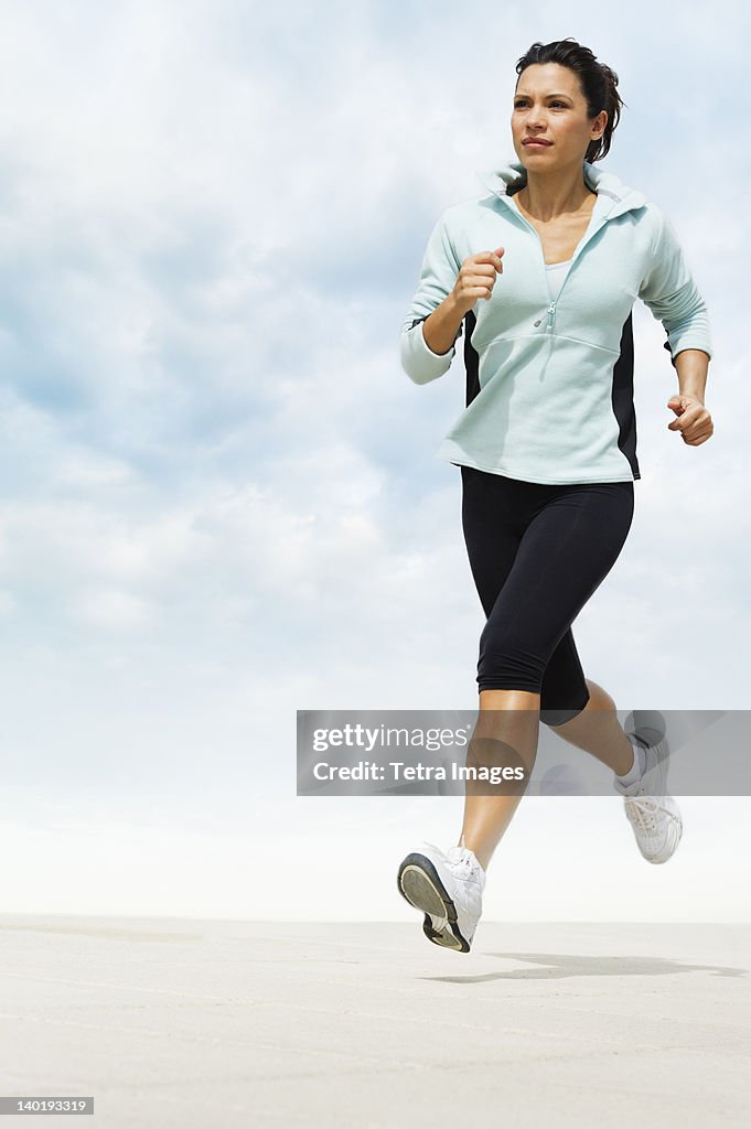 USA, New Jersey, Jersey City, Woman jogging