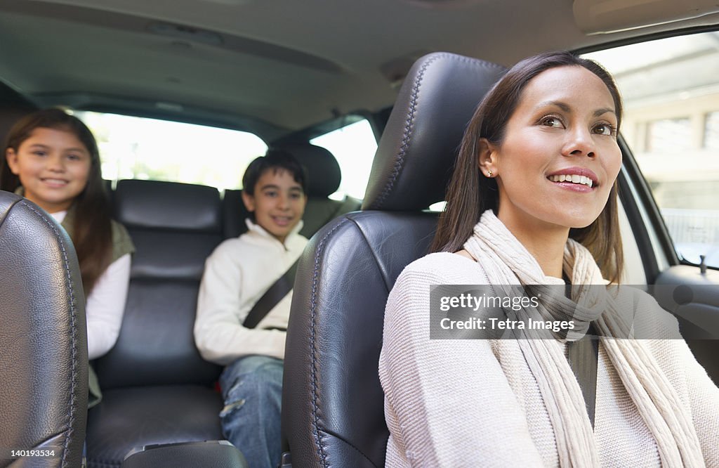 USA, New Jersey, Jersey City, Mother with son (12-13) and daughter (10-11) in car