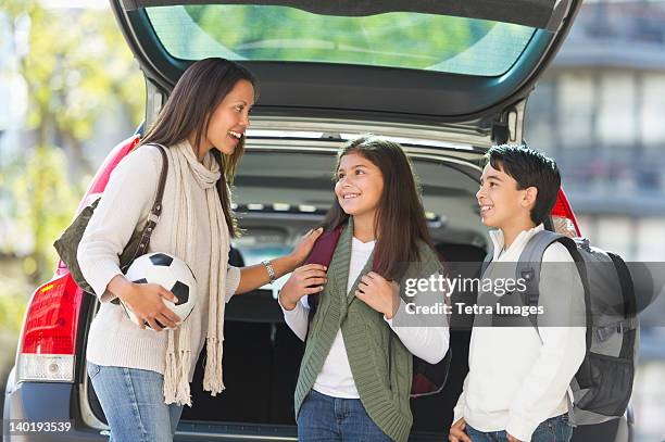 usa, new jersey, jersey city, mother with son (12-13) and daughter (10-11) - jersey city stock pictures, royalty-free photos & images