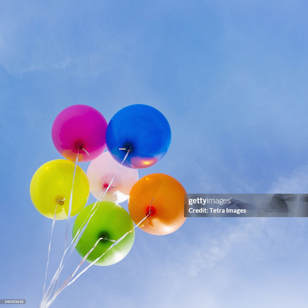 USA, New Jersey, Jersey City, Balloons against blue sky