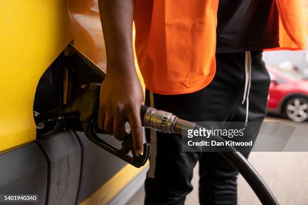 Man puts fuel in his van on a petrol station forecourt on June 09, 2022 in London, England. UK Fuel prices rose again today bringing the cost of...