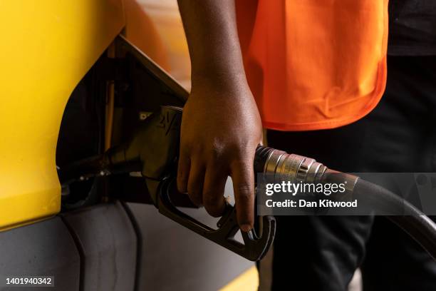 Man puts fuel in his van on a petrol station forecourt on June 09, 2022 in London, England. UK Fuel prices rose again today bringing the cost of...