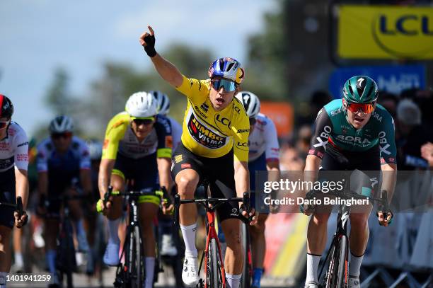 Wout Van Aert of Belgium and Team Jumbo - Visma Yellow Leader Jersey celebrates winning ahead of Jordi Meeus of Belgium and Team Bora - Hansgrohe...