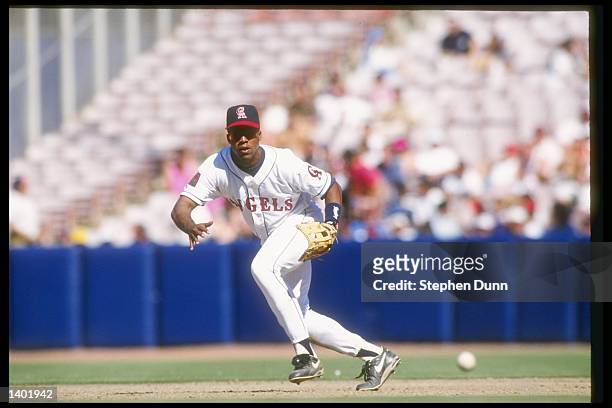Infielder Eduardo Perez of the California Angels runs to field the ball during a game against the Cleveland Indians at Anaheim Stadium in Anaheim,...