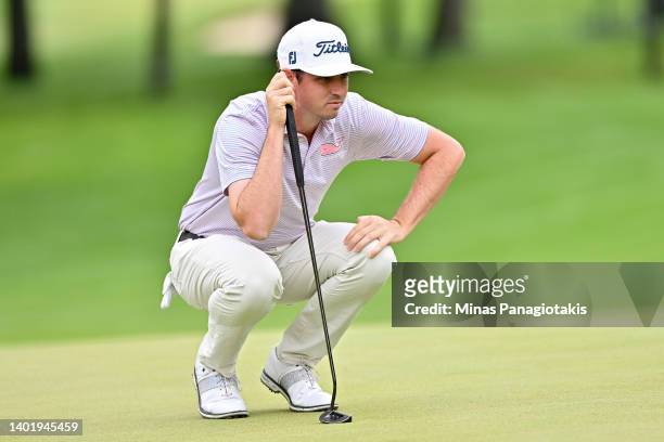 Poston of the United States lines up a putt on the seventh green during the first round of the RBC Canadian Open at St. George's Golf and Country...