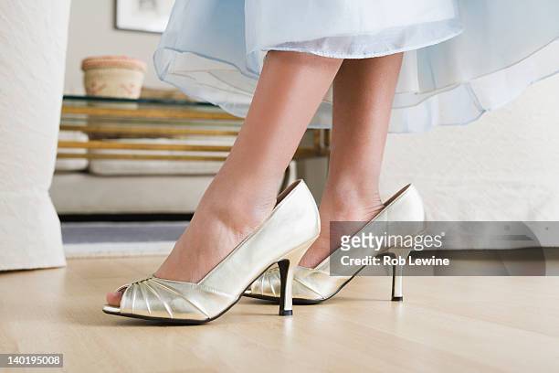 usa, california, los angeles, low section of girl (10-11) wearing oversized shoes - tween heels stock pictures, royalty-free photos & images