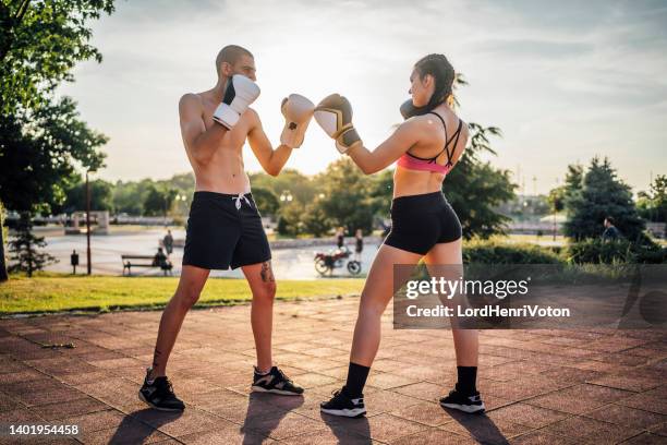 man and woman at kickboxing sparring - an evening dedicated to women of substance imagens e fotografias de stock