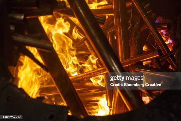 copper pipes in a furnace - alloy stockfoto's en -beelden