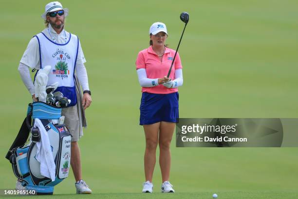 Charlotte Heath of England and The GB&I team prepares to play a shot with her caddie Grant Middleton during a practice round ahead of The Curtis Cup...