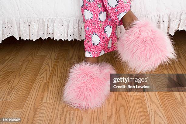 usa, california, los angeles, close up of girl's (10-11) legs in pajamas and slippers - girls sleepover stock-fotos und bilder