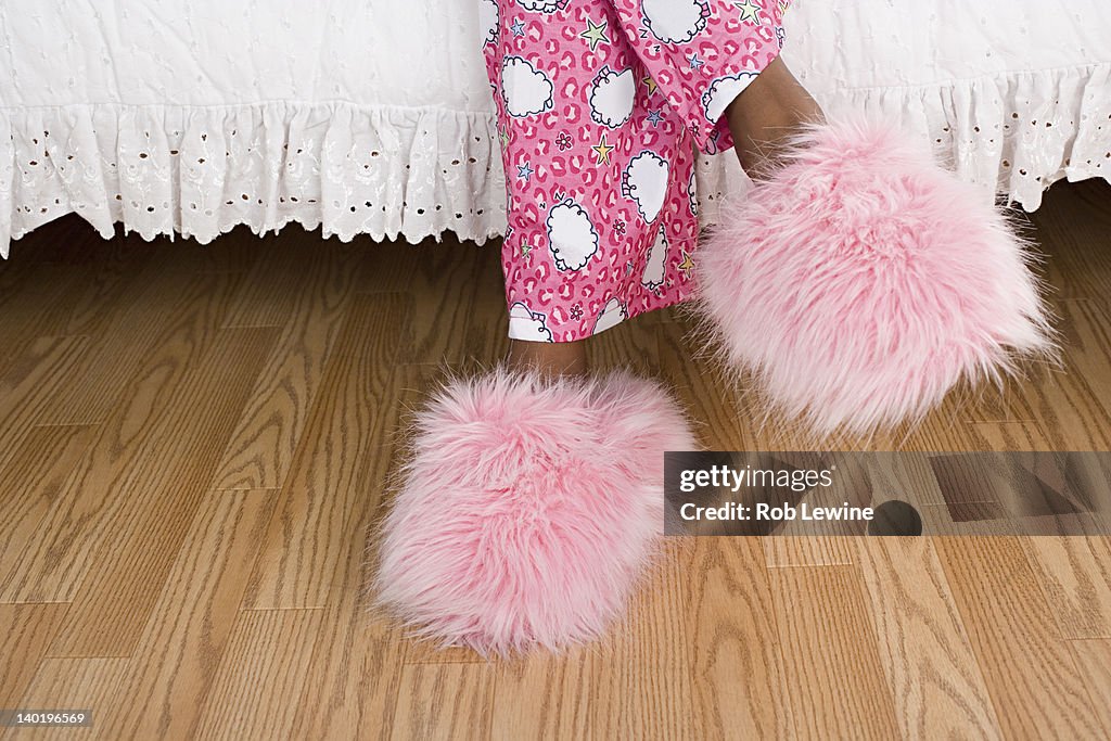 USA, California, Los Angeles, Close up of girl's (10-11) legs in pajamas and slippers