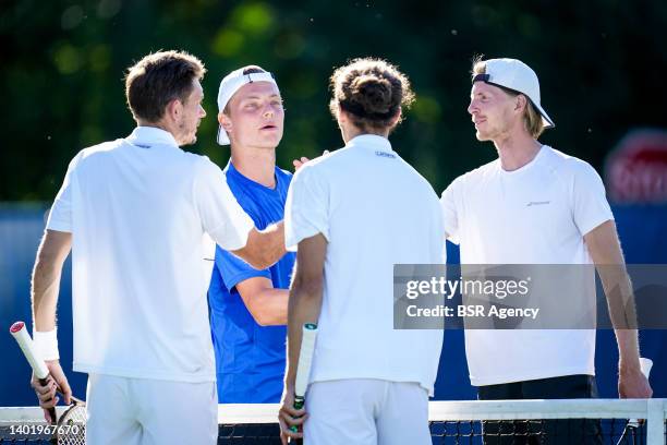 Tim van Rijthoven of the Netherlands and Gijs Brouwer of the Netherlands shake hands during the Mens Doubles First Round match against Pierre-Hugues...