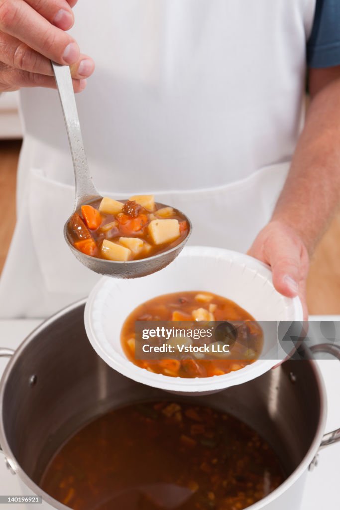 USA, Illinois, Metamora, Volunteer serving soup